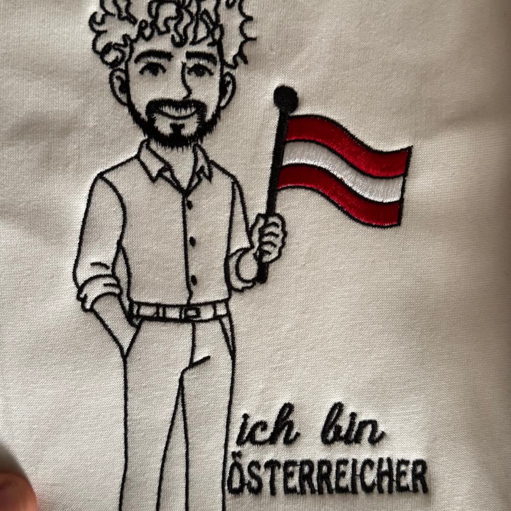 Besticktes Charaktermotiv mit Österreich-Fahne und Schriftzug 'ich bin Österreicher'
